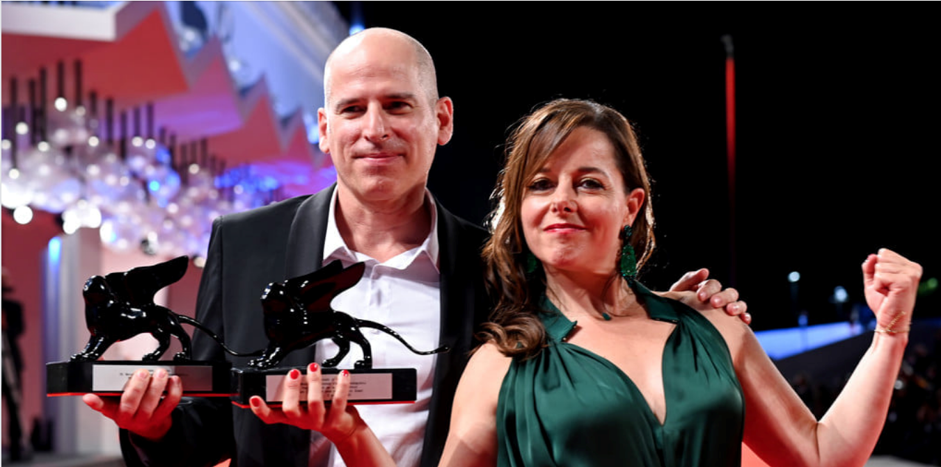 Director Eric Gravel and actor Laure Calamy hold their awards.