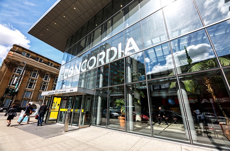 Building made of glass with the word "Concordia" printed in big letters on the front.
