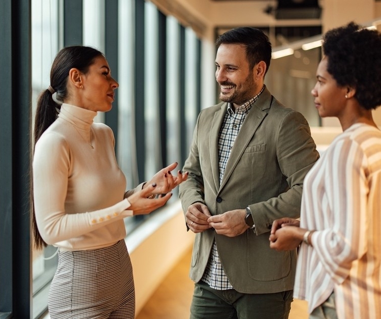 Three professionals in conversation